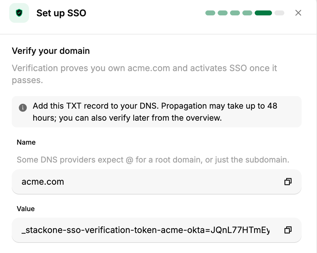 StackOne's Verify your domain step showing the DNS TXT record name and value.